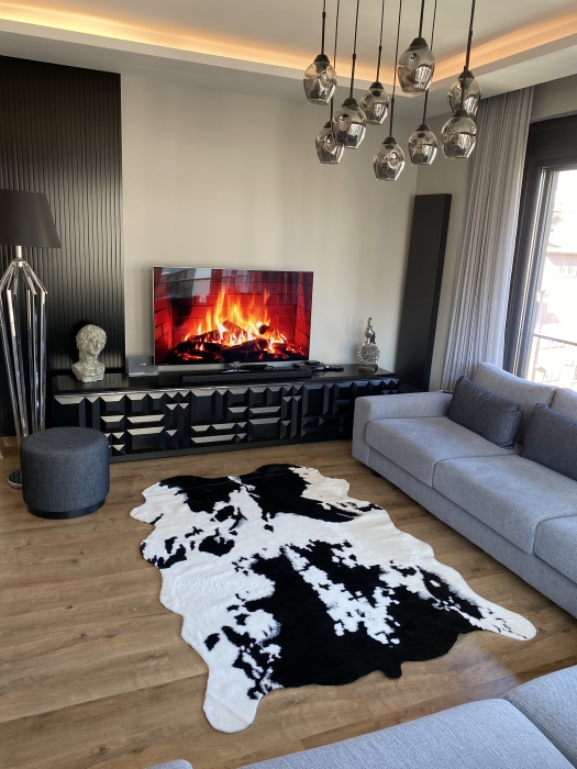 The artificial cow rug features a realistic, printed design that brings a touch of nature into you home decor