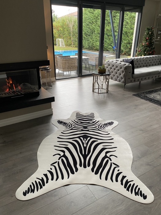The artificial cow rug features a realistic, printed design that brings a touch of nature into you home decor