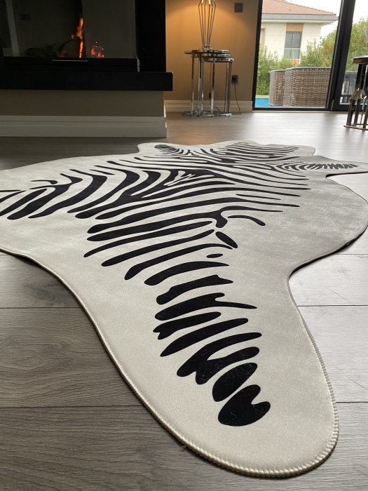 The artificial cow rug features a realistic, printed design that brings a touch of nature into you home decor
