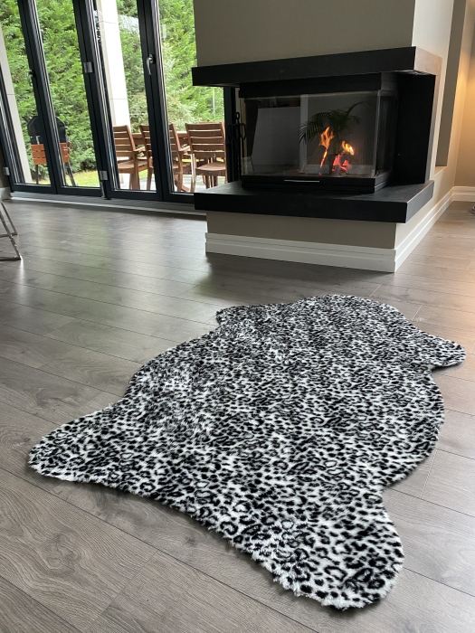 The artificial cow rug features a realistic, printed design that brings a touch of nature into you home decor