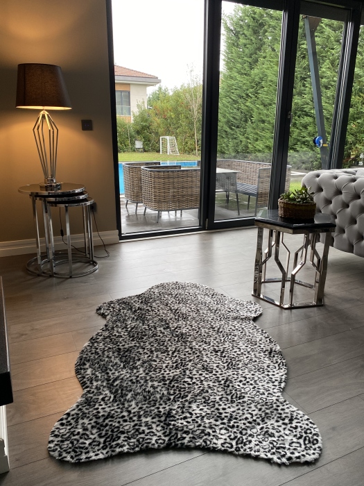 The artificial cow rug features a realistic, printed design that brings a touch of nature into you home decor
