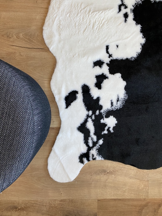 The artificial cow rug features a realistic, printed design that brings a touch of nature into you home decor