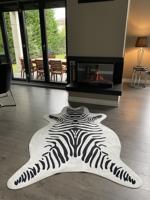 The artificial cow rug features a realistic, printed design that brings a touch of nature into you home decor