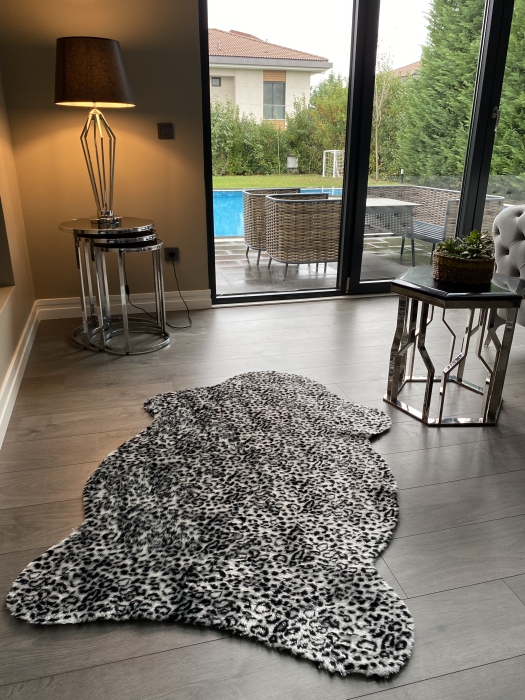 The artificial cow rug features a realistic, printed design that brings a touch of nature into you home decor