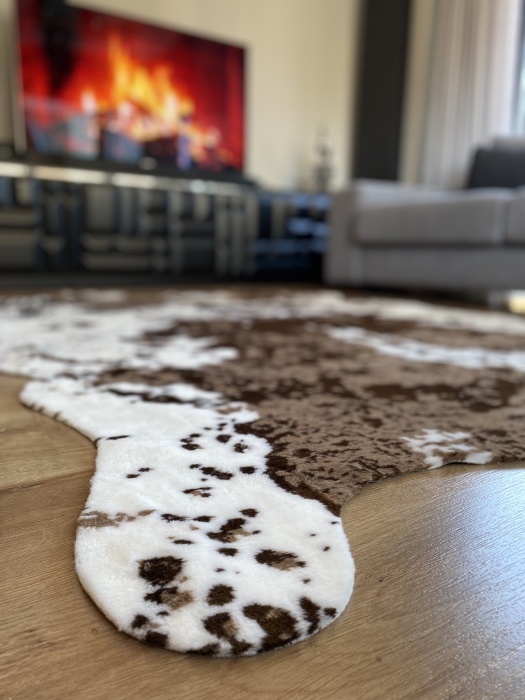 The artificial cow rug features a realistic, printed design that brings a touch of nature into you home decor