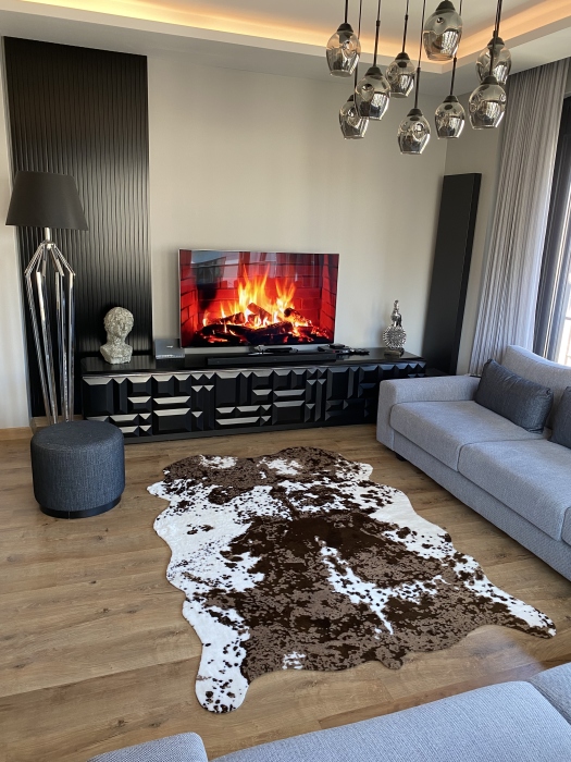 The artificial cow rug features a realistic, printed design that brings a touch of nature into you home decor