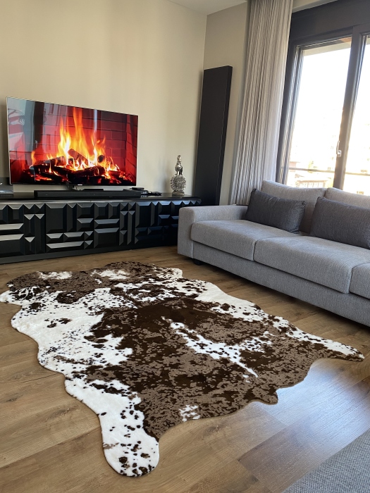 The artificial cow rug features a realistic, printed design that brings a touch of nature into you home decor