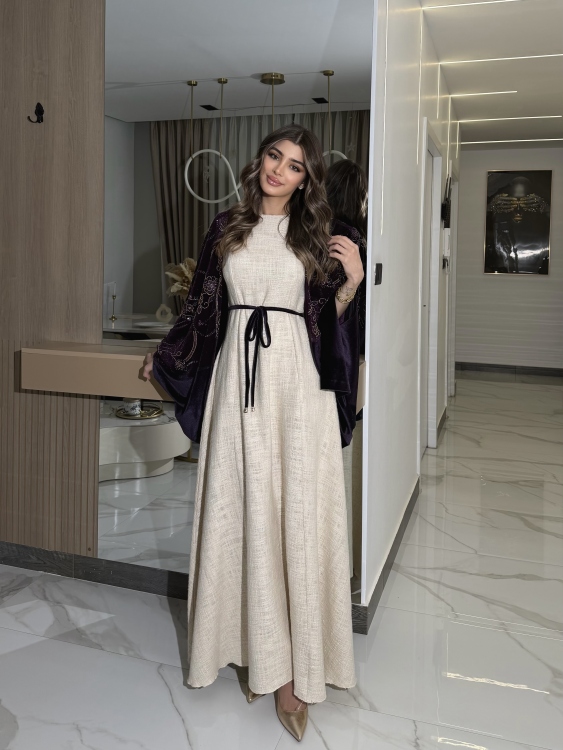 جلابية لينا top ‏Heavy linen dress paired with a shirred velvet 