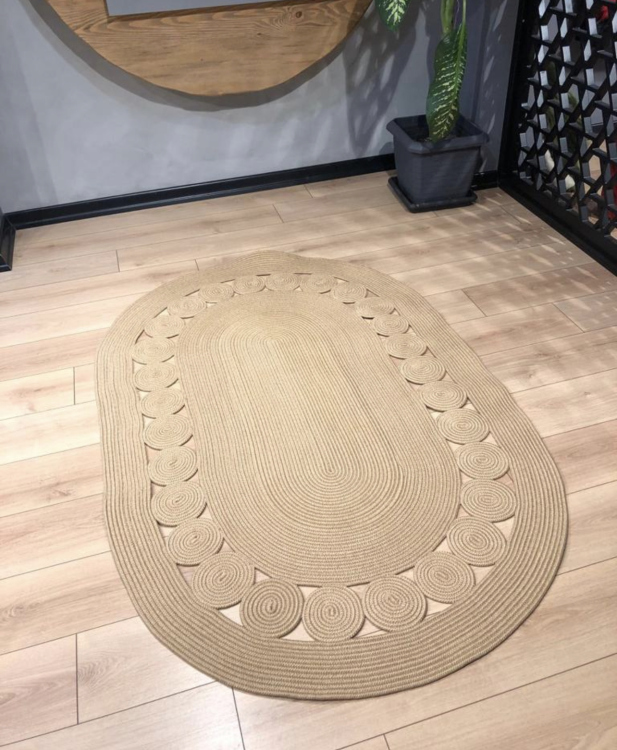 Experience the luxurious feel of a handmade natural jute rug with its high-quality fibers and unique designs.