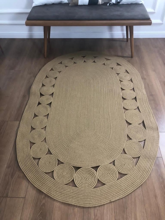 Experience the luxurious feel of a handmade natural jute rug with its high-quality fibers and unique designs.