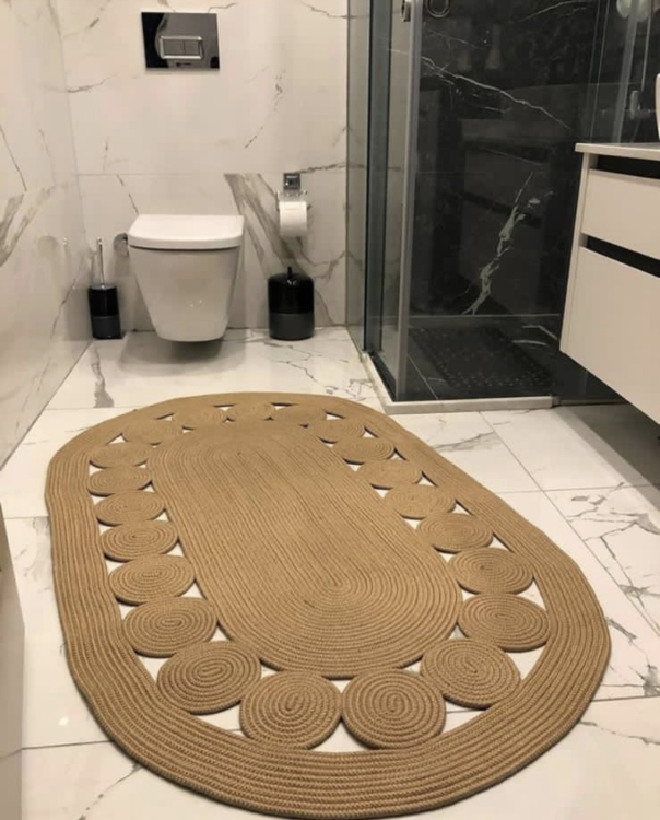 Experience the luxurious feel of a handmade natural jute rug with its high-quality fibers and unique designs.