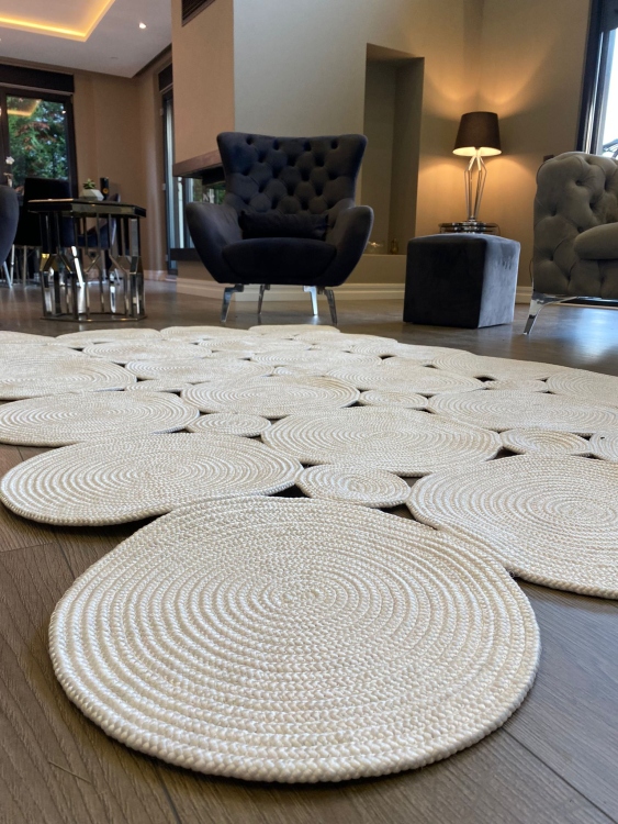 Experience the luxurious feel of a handmade natural jute rug with its high-quality fibers and unique designs.