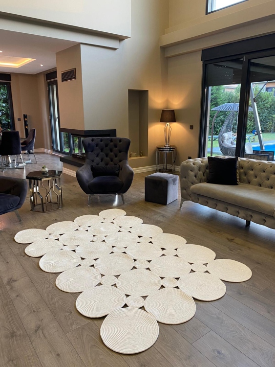 Experience the luxurious feel of a handmade natural jute rug with its high-quality fibers and unique designs.