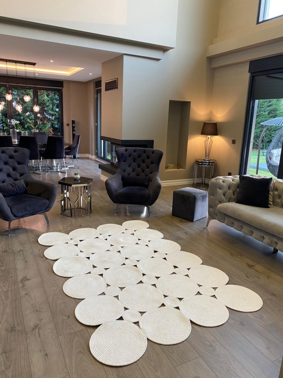 Experience the luxurious feel of a handmade natural jute rug with its high-quality fibers and unique designs.