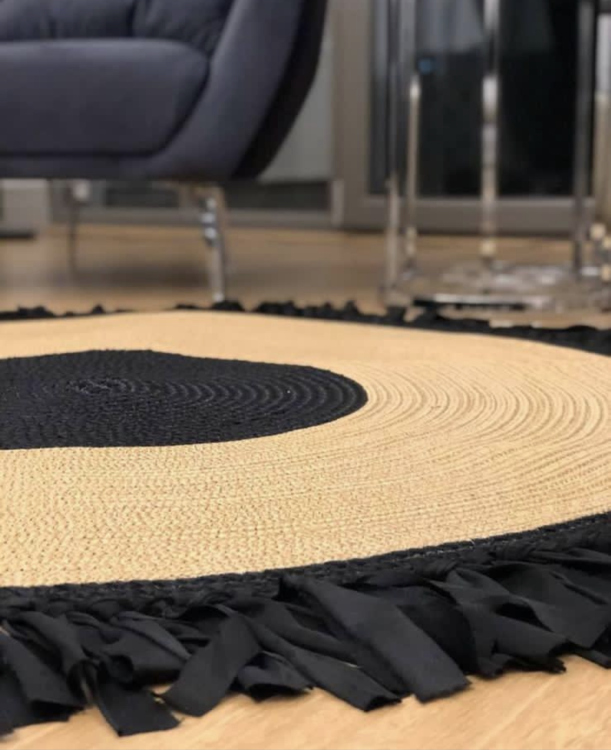 Experience the luxurious feel of a handmade natural jute rug with its high-quality fibers and unique designs.