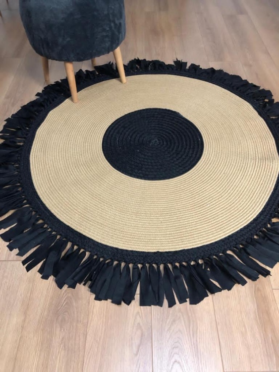 Experience the luxurious feel of a handmade natural jute rug with its high-quality fibers and unique designs.