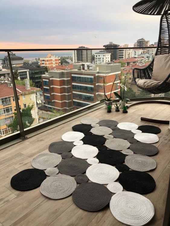 Experience the luxurious feel of a handmade natural jute rug with its high-quality fibers and unique designs.