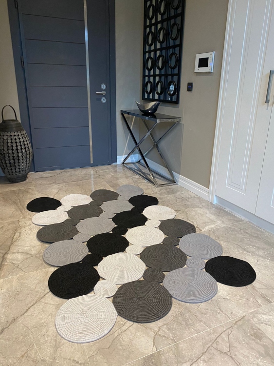 Experience the luxurious feel of a handmade natural jute rug with its high-quality fibers and unique designs.