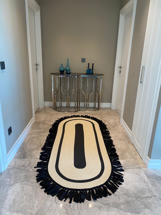 Experience the luxurious feel of a handmade natural jute rug with its high-quality fibers and unique designs. .