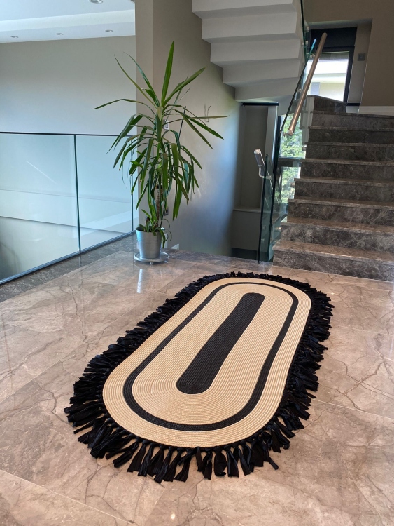 Experience the luxurious feel of a handmade natural jute rug with its high-quality fibers and unique designs. .