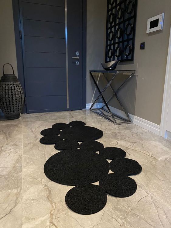 Experience the luxurious feel of a handmade natural jute rug with its high-quality fibers and unique designs.