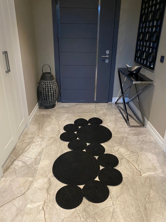 Experience the luxurious feel of a handmade natural jute rug with its high-quality fibers and unique designs.