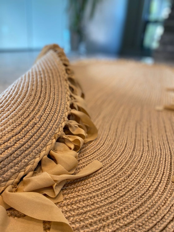 Experience the luxurious feel of a handmade natural jute rug with its high-quality fibers and unique designs.