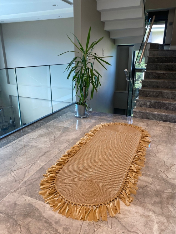 Experience the luxurious feel of a handmade natural jute rug with its high-quality fibers and unique designs.