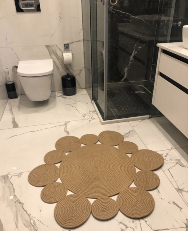 Experience the luxurious feel of a handmade natural jute rug with its high-quality fibers and unique designs.