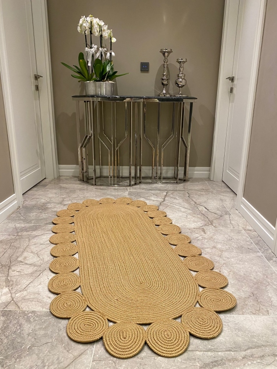 Experience the luxurious feel of a handmade natural jute rug with its high-quality fibers and unique designs.