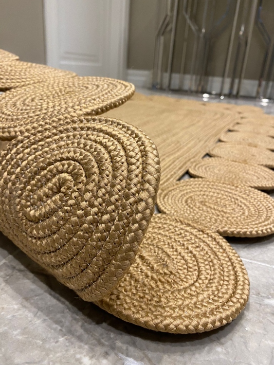 Experience the luxurious feel of a handmade natural jute rug with its high-quality fibers and unique designs.
