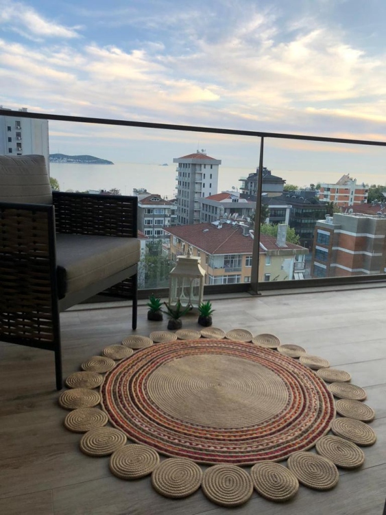 Experience the luxurious feel of a handmade natural jute rug with its high-quality fibers and unique designs.