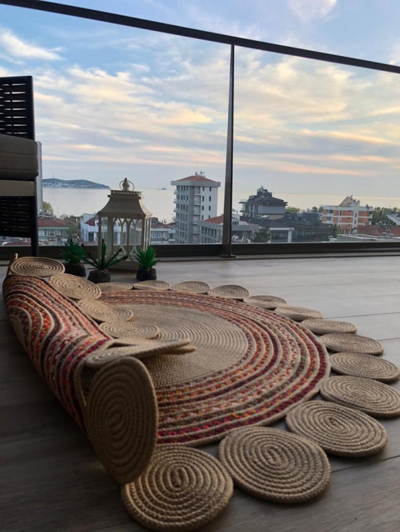 Experience the luxurious feel of a handmade natural jute rug with its high-quality fibers and unique designs.