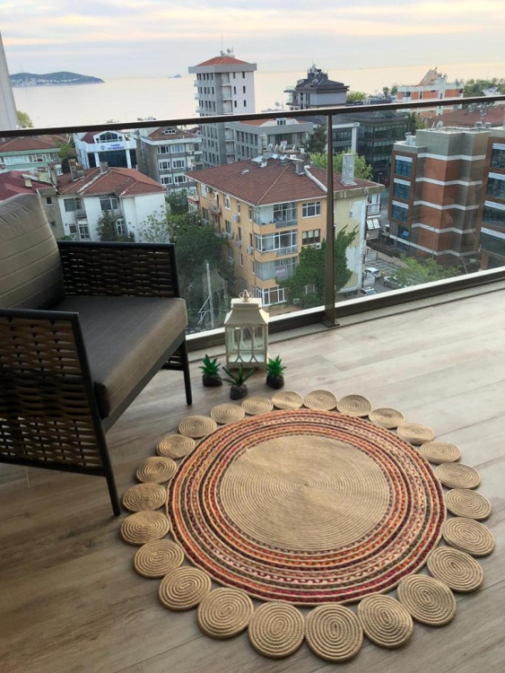 Experience the luxurious feel of a handmade natural jute rug with its high-quality fibers and unique designs.