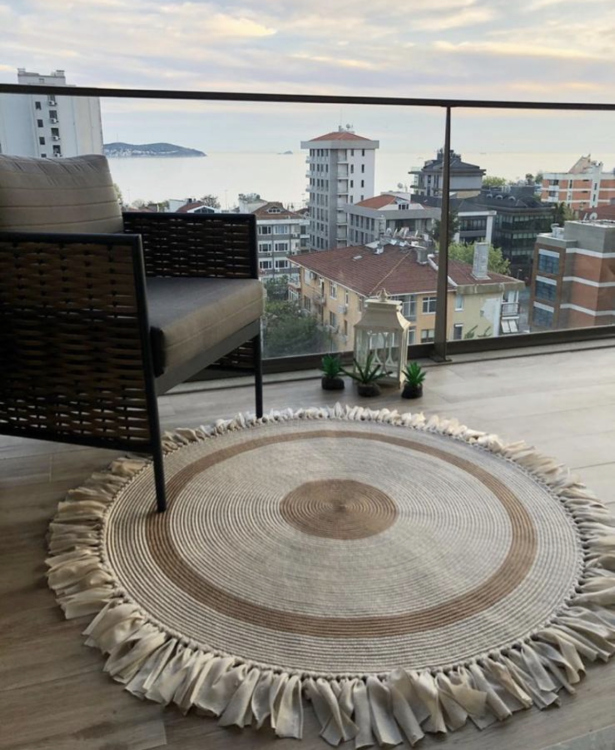Experience the luxurious feel of a handmade natural jute rug with its high-quality fibers and unique designs.
