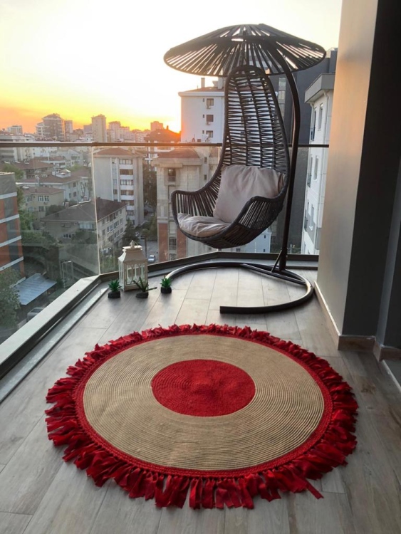 Experience the luxurious feel of a handmade natural jute rug with its high-quality fibers and unique designs.