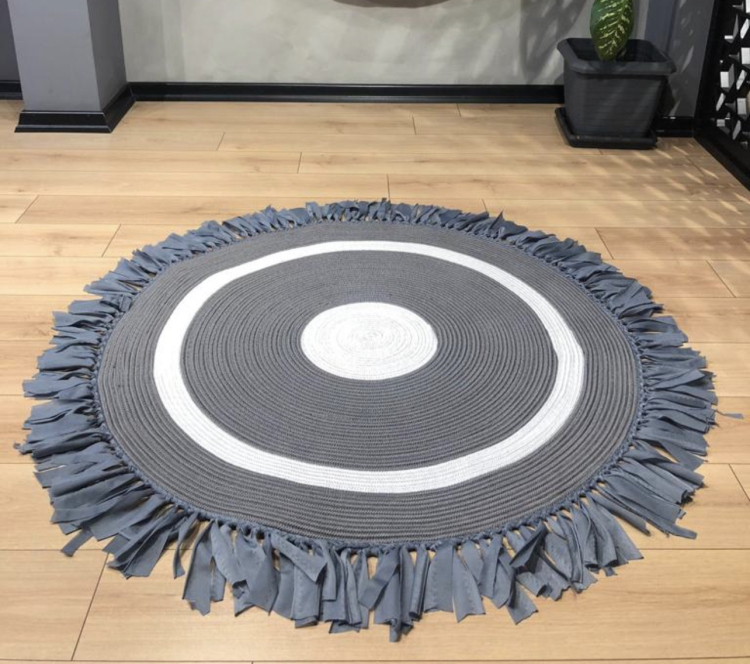 Experience the luxurious feel of a handmade natural jute rug with its high-quality fibers and unique designs.