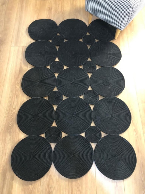 Experience the luxurious feel of a handmade natural jute rug with its high-quality fibers and unique designs.