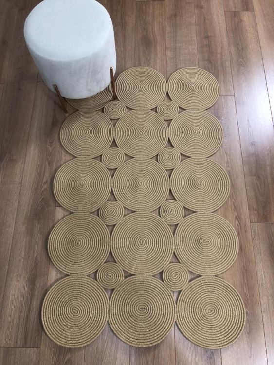 Experience the luxurious feel of a handmade natural jute rug with its high-quality fibers and unique designs.