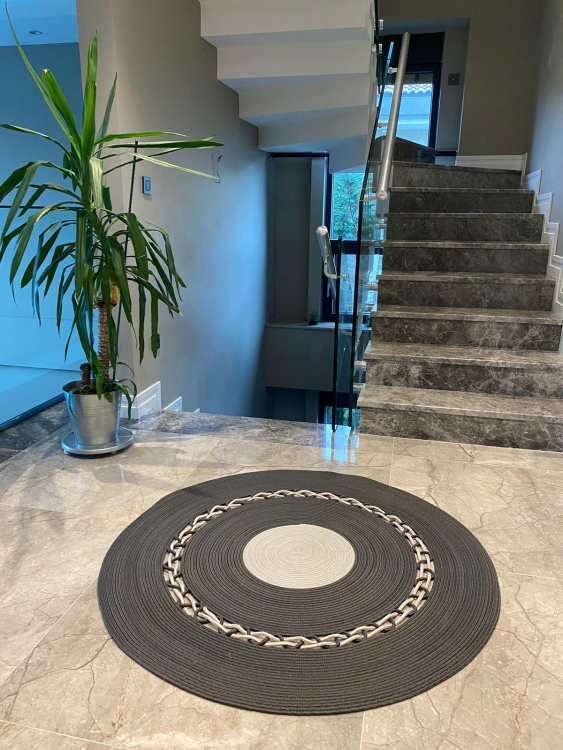 Experience the luxurious feel of a handmade natural jute rug with its high-quality fibers and unique designs.