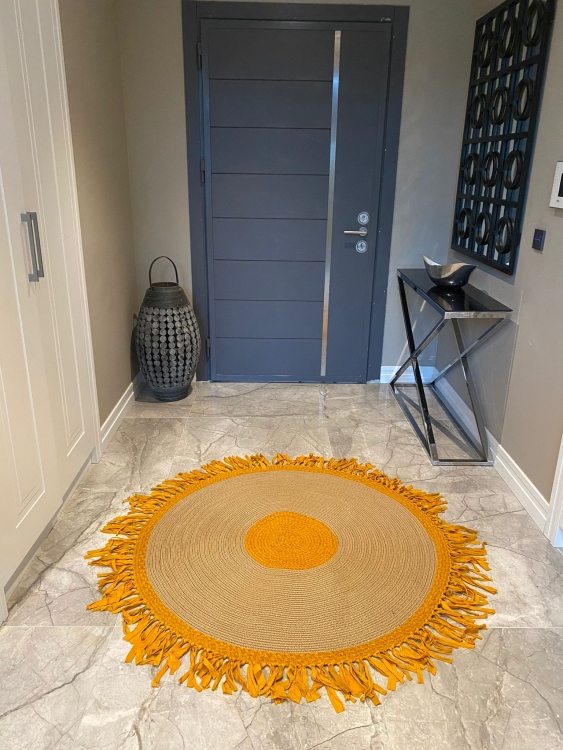 Experience the luxurious feel of a handmade natural jute rug with its high-quality fibers and unique designs.