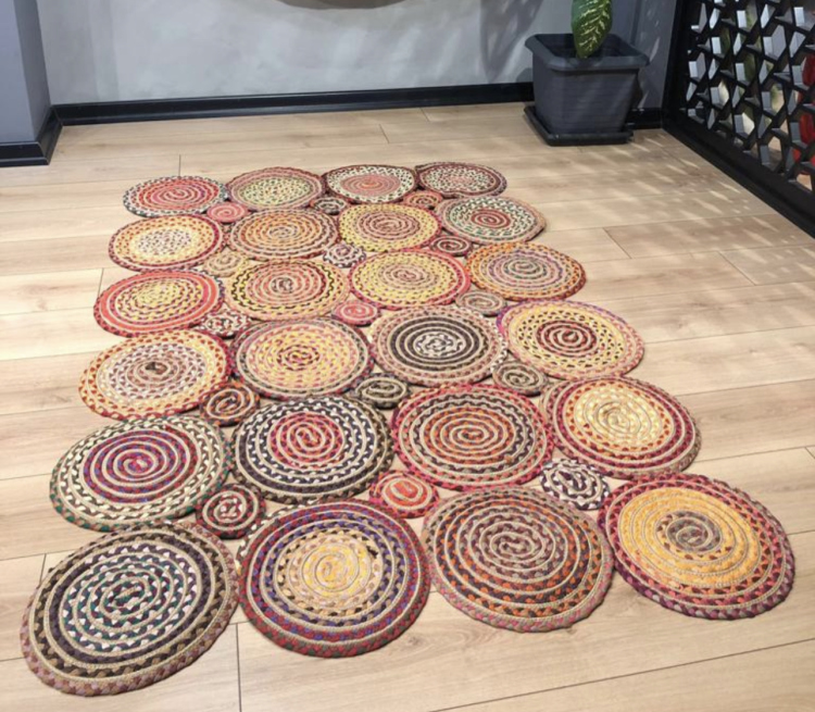 Experience the luxurious feel of a handmade natural jute rug with its high-quality fibers and unique designs.