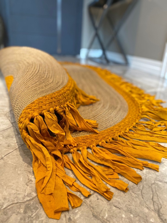 Experience the luxurious feel of a handmade natural jute rug with its high-quality fibers and unique designs.