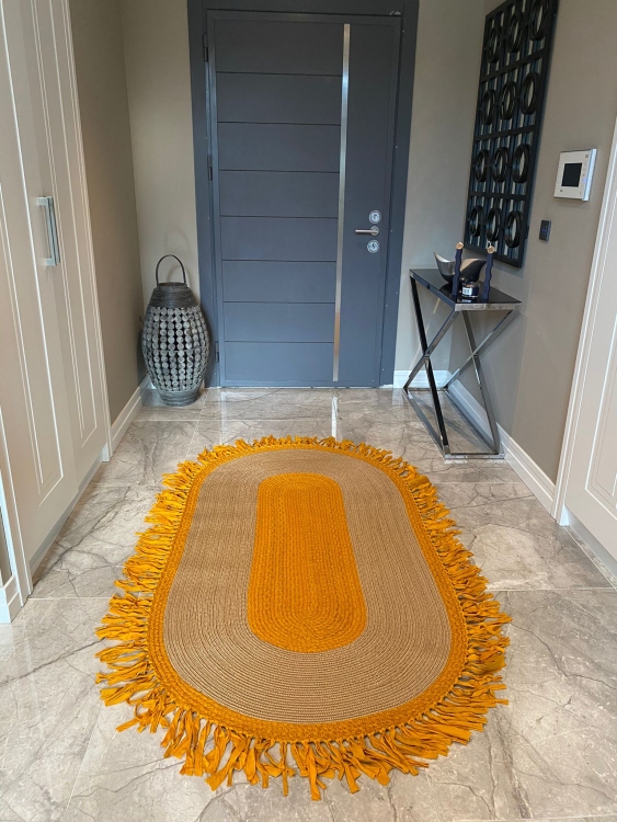 Experience the luxurious feel of a handmade natural jute rug with its high-quality fibers and unique designs.