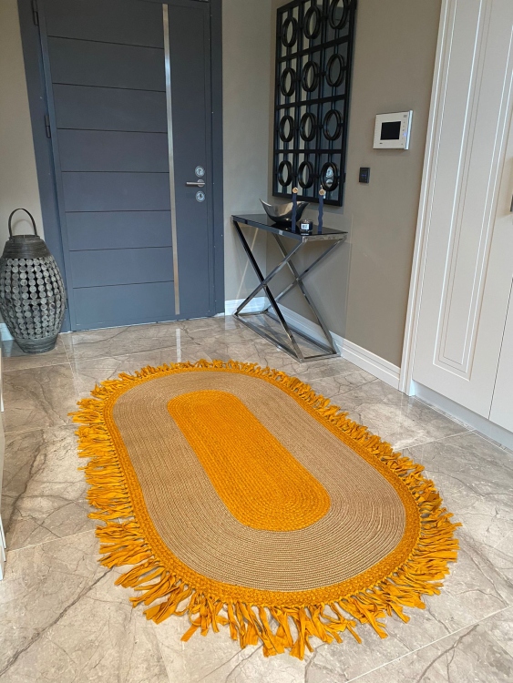 Experience the luxurious feel of a handmade natural jute rug with its high-quality fibers and unique designs.