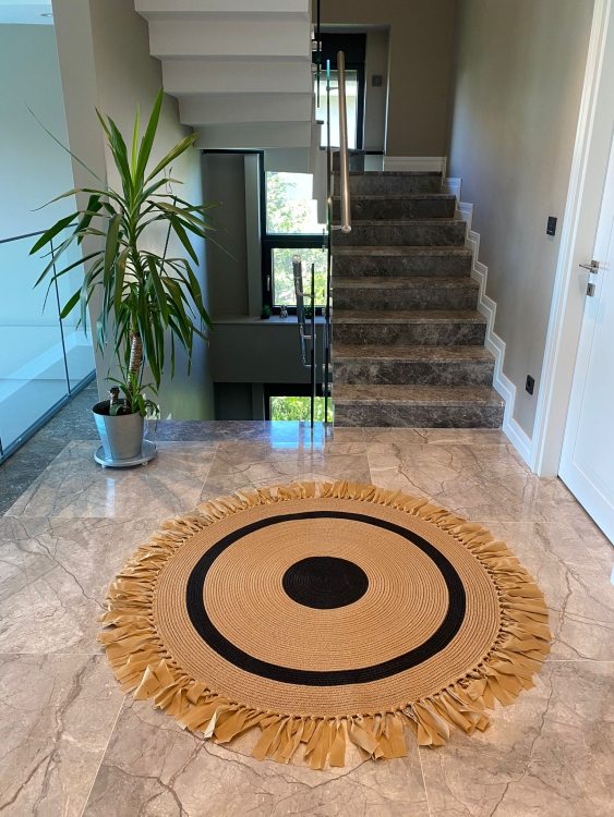 Experience the luxurious feel of a handmade natural jute rug with its high-quality fibers and unique designs.