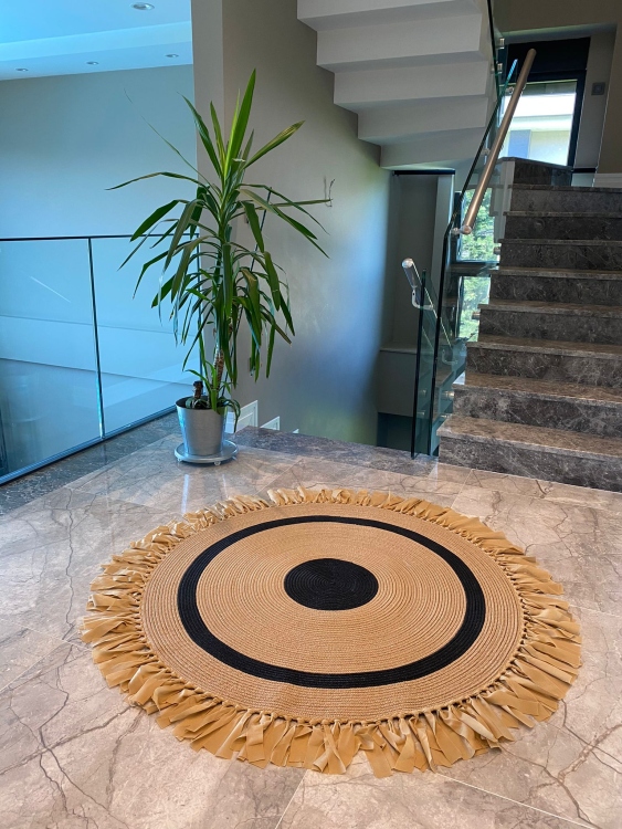 Experience the luxurious feel of a handmade natural jute rug with its high-quality fibers and unique designs.