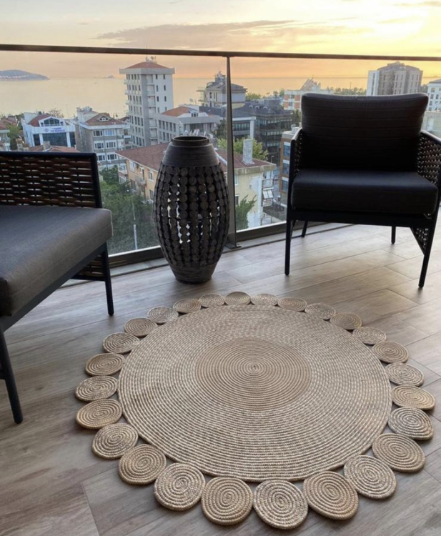 Experience the luxurious feel of a handmade natural jute rug with its high-quality fibers and unique designs.