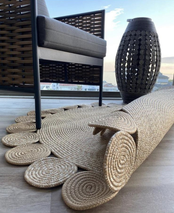 Experience the luxurious feel of a handmade natural jute rug with its high-quality fibers and unique designs.