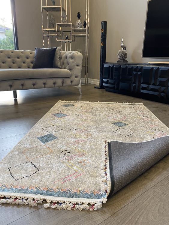 This vibrant digital printed rug features a bold pattern with pops of color, finished off with colorful fringes or braided fringes